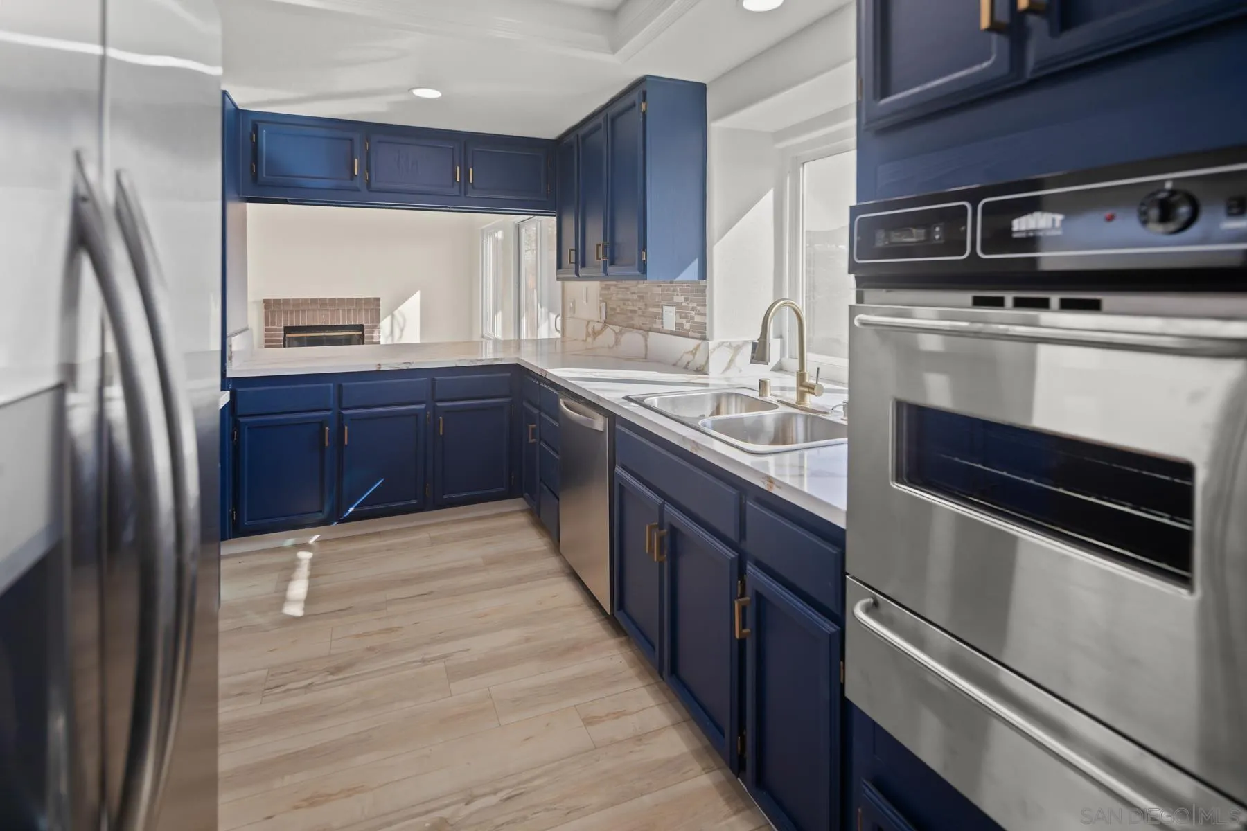 10167 Bluestone Court Spring Valley, CA 91977 - Photo 12 of 49 a kitchen with stainless steel appliances granite countertop a refrigerator stove and sink