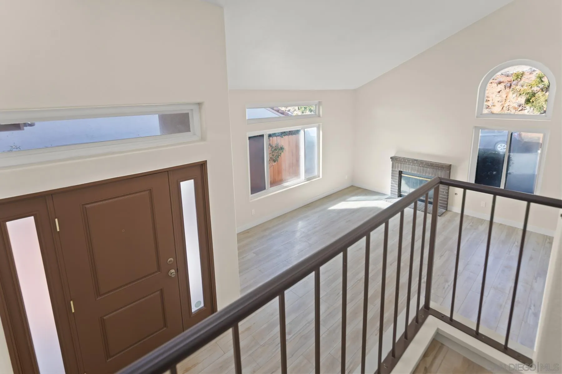 10167 Bluestone Court Spring Valley, CA 91977 - Photo 16 of 49 a view of a hallway with wooden floor and stairs