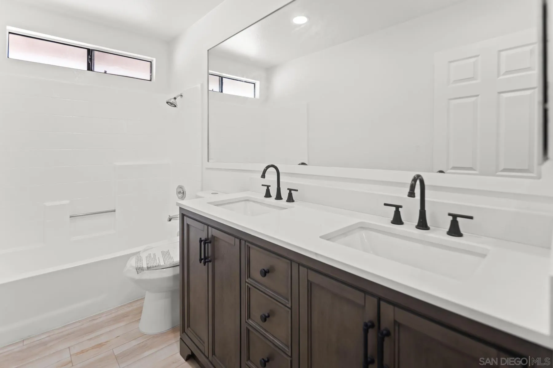 10167 Bluestone Court Spring Valley, CA 91977 - Photo 17 of 49 a bathroom with a sink and a toilet