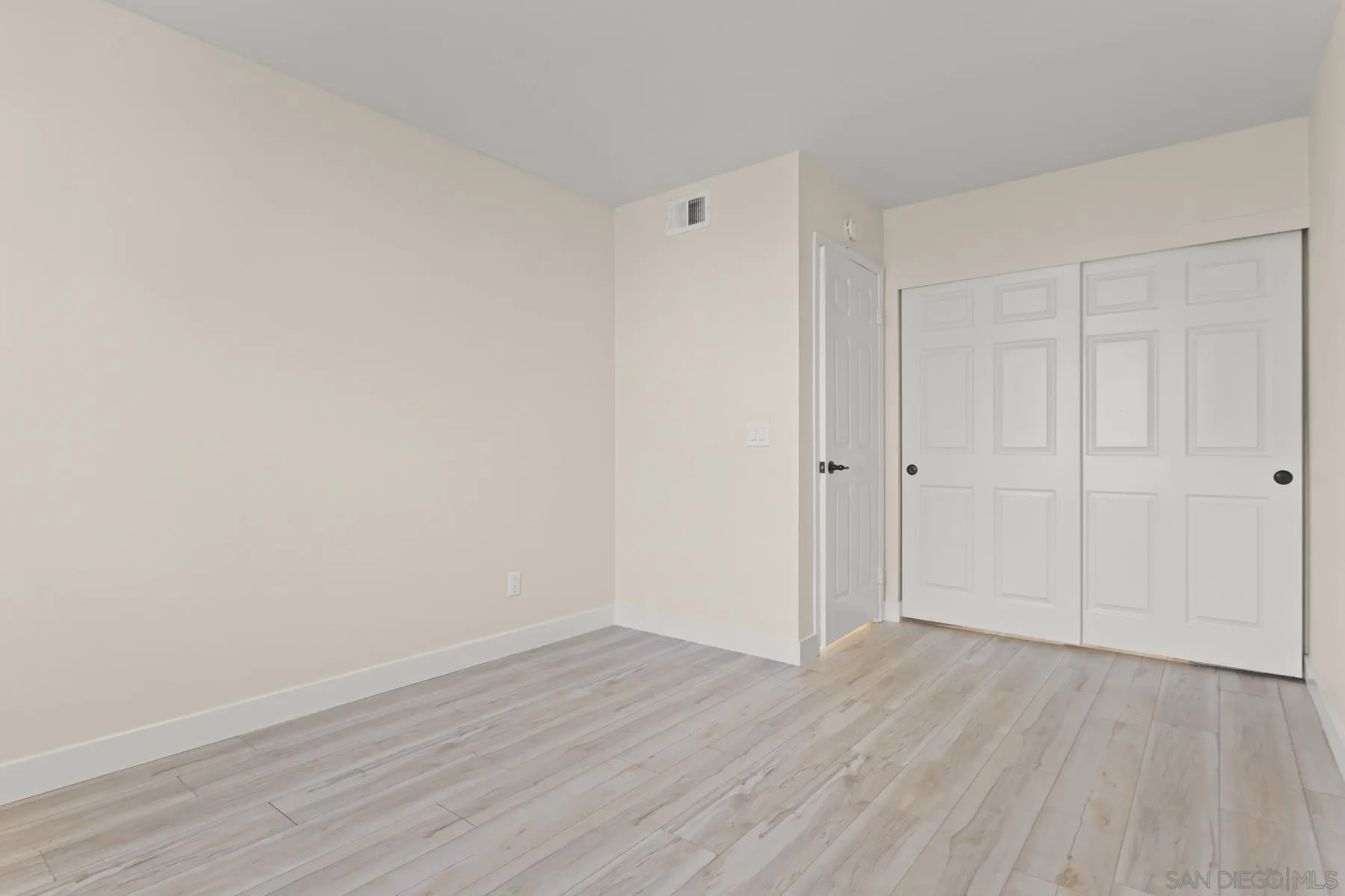 10167 Bluestone Court Spring Valley, CA 91977 - Photo 21 of 49 a view of an empty room with wooden floor