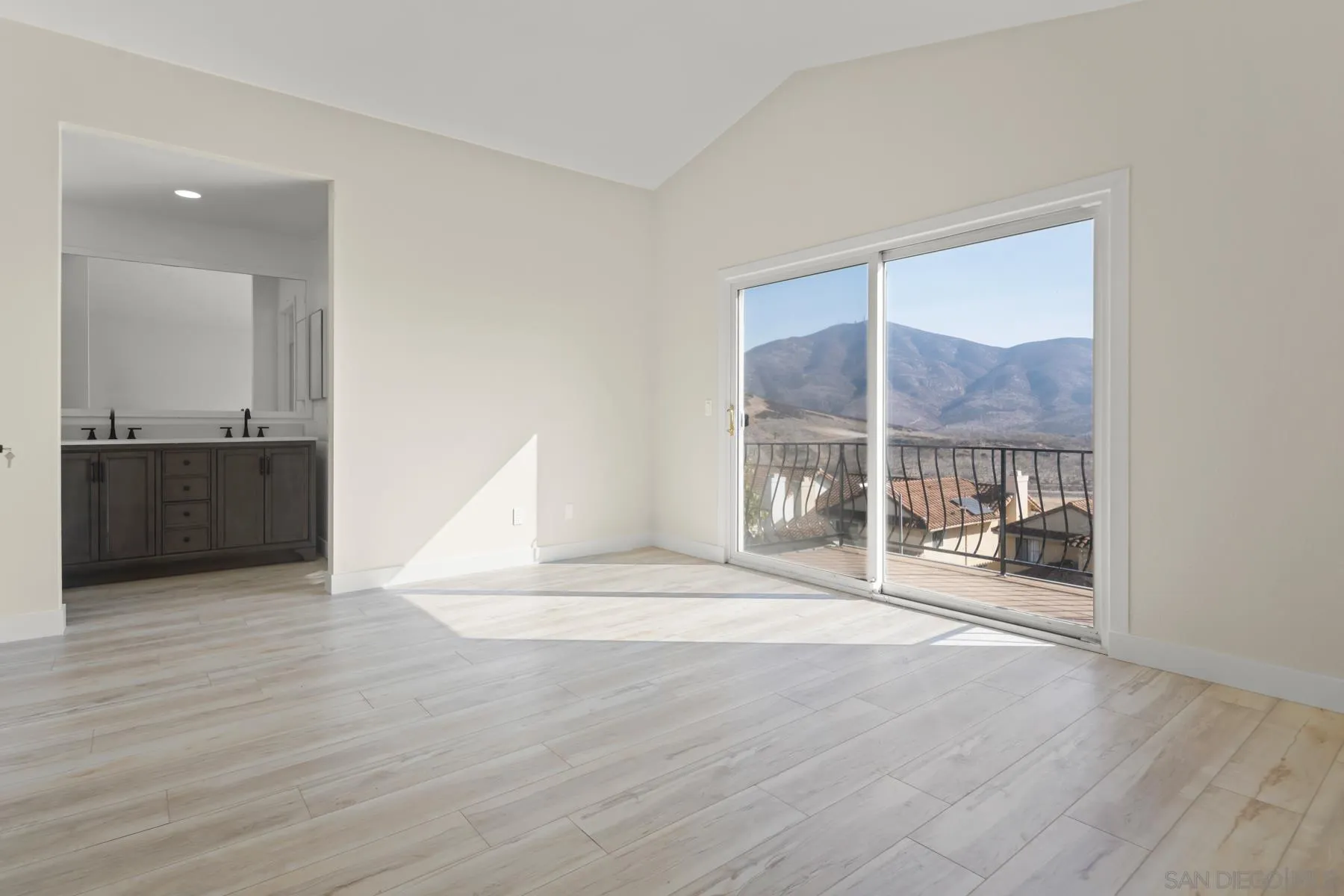 10167 Bluestone Court Spring Valley, CA 91977 - Photo 22 of 49 an empty room with wooden floor and a cabinet