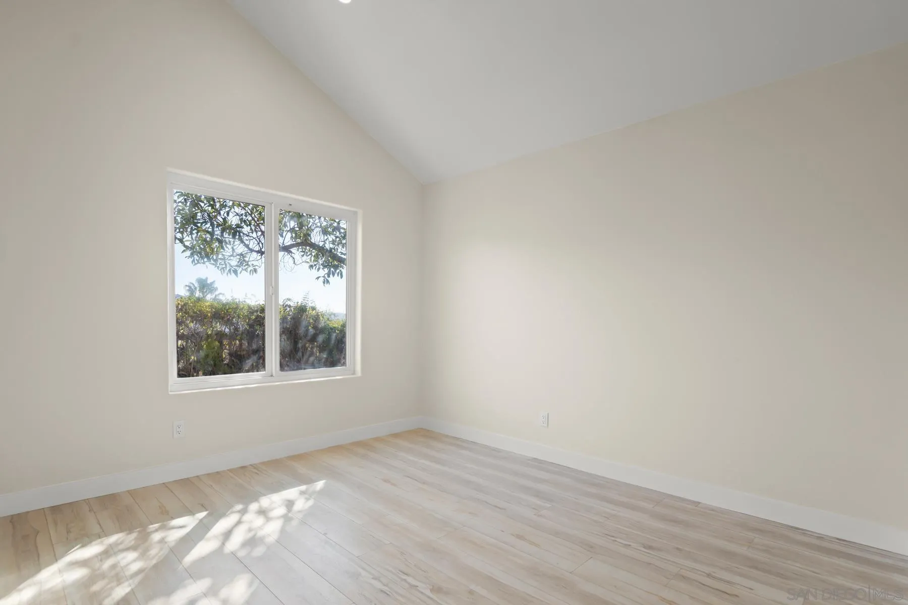 10167 Bluestone Court Spring Valley, CA 91977 - Photo 3 of 49 an empty room with wooden floor and windows