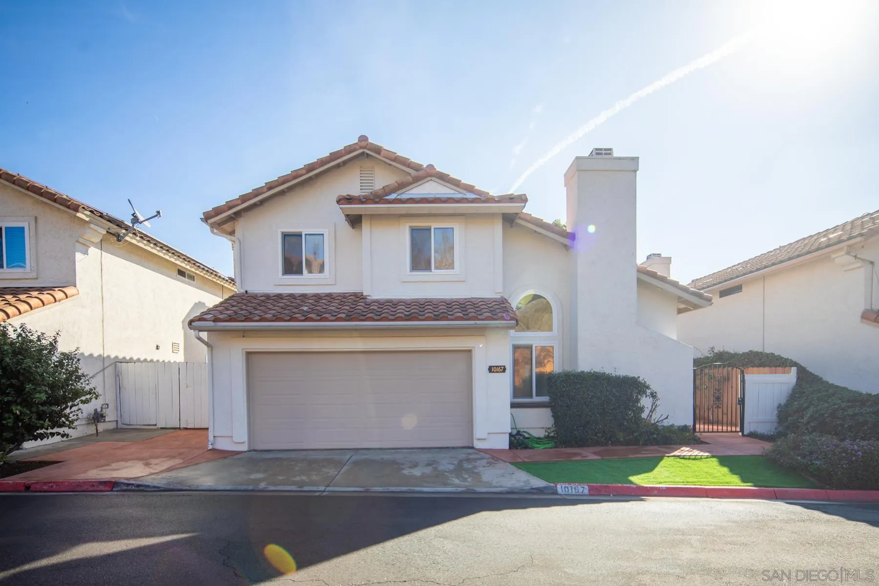 10167 Bluestone Court Spring Valley, CA 91977 - Photo 46 of 49 a front view of a house with a yard and garage