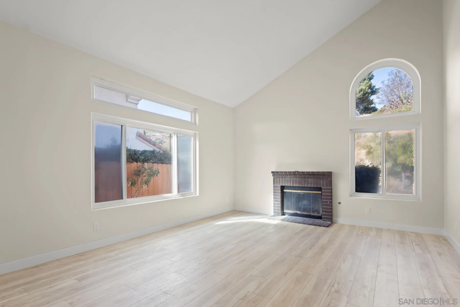 10167 Bluestone Court Spring Valley, CA 91977 - Photo 49 of 49 an empty room with windows and fireplace