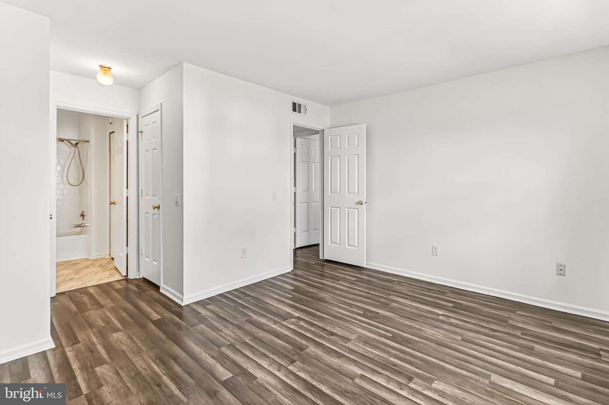 120 Prosperity Avenue Southeast, Unit E Leesburg, VA 20175 - Photo 21 of 34 a view of hallway with wooden floor