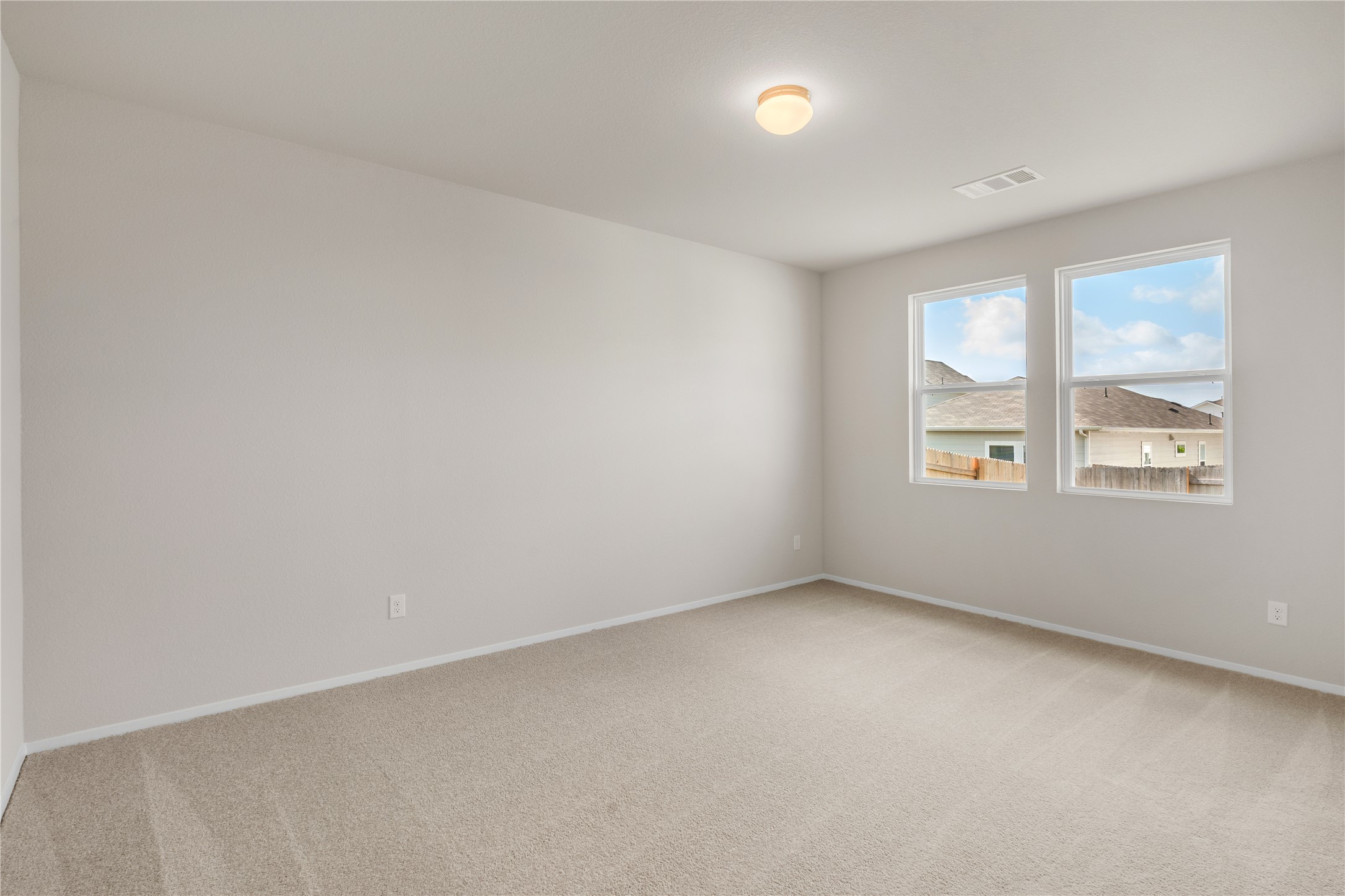 2615 Towy Road Manor, TX 78653 - Photo 11 of 38 Spare room with light colored carpet and baseboards