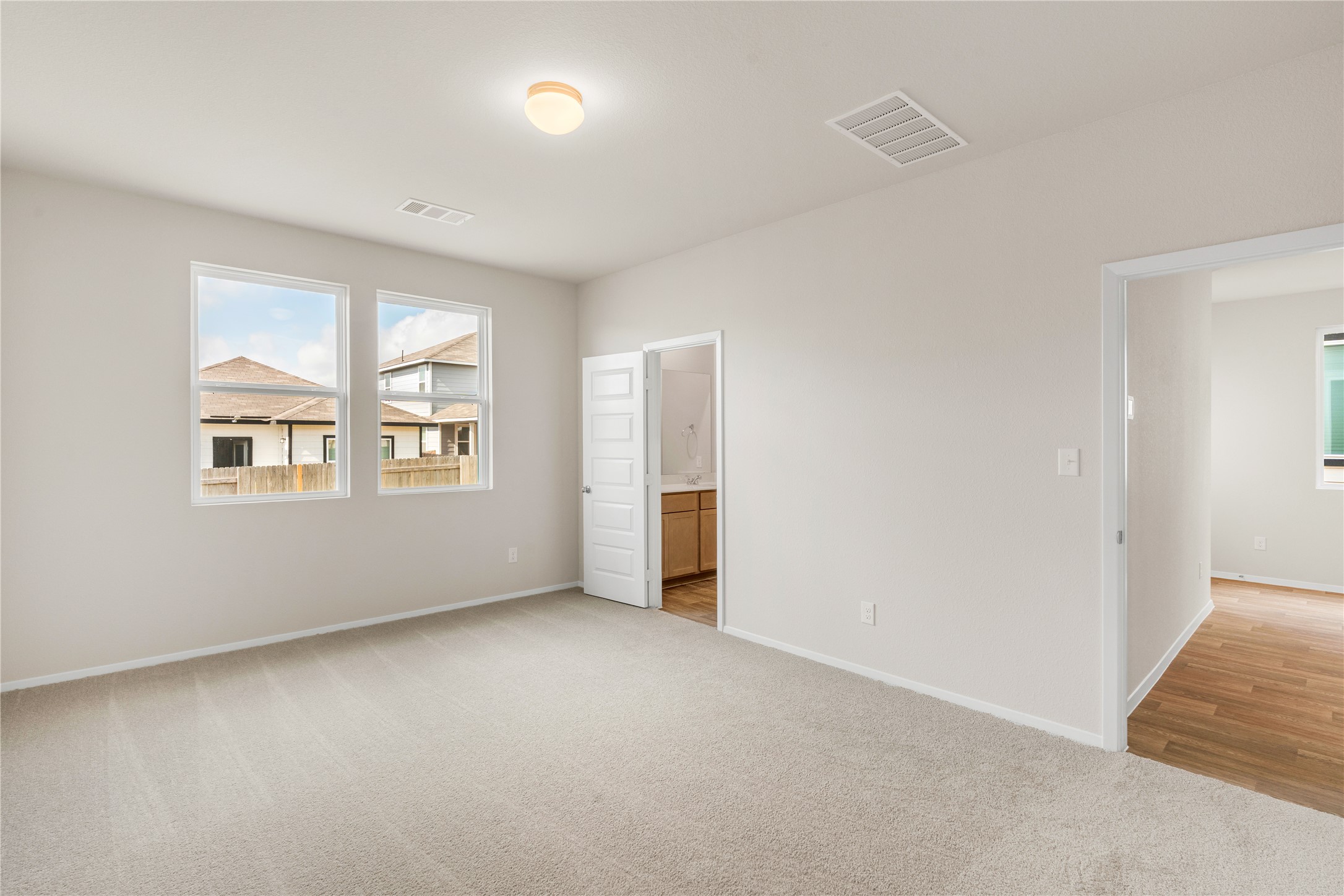 2615 Towy Road Manor, TX 78653 - Photo 12 of 38 Unfurnished bedroom featuring light carpet and ensuite bath