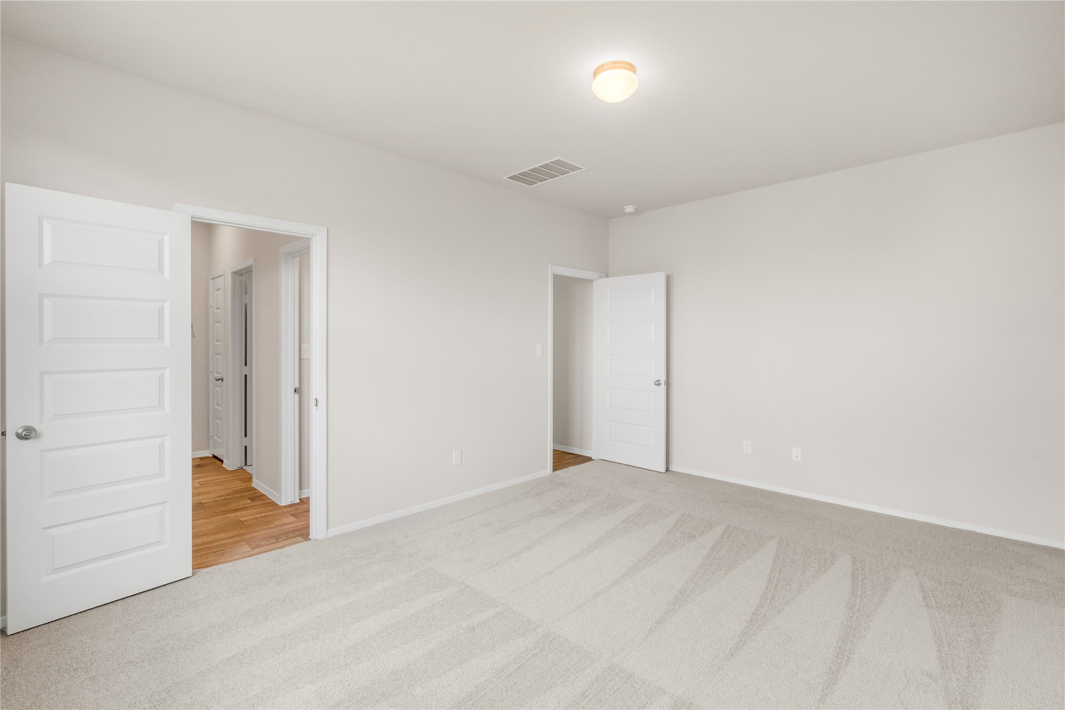 2615 Towy Road Manor, TX 78653 - Photo 13 of 38 Unfurnished bedroom with light colored carpet and baseboards