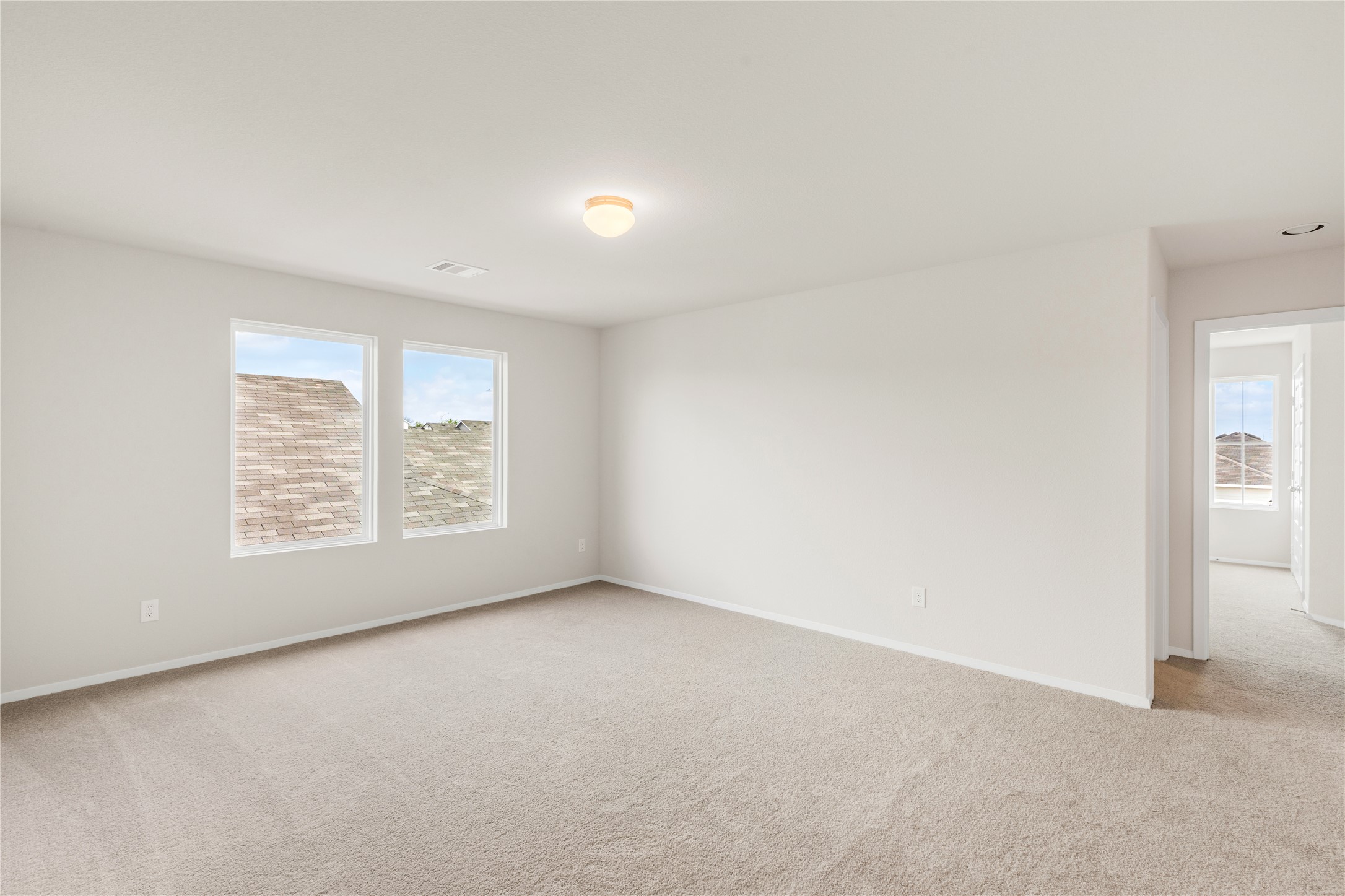 2615 Towy Road Manor, TX 78653 - Photo 19 of 38 Empty room with light carpet and baseboards