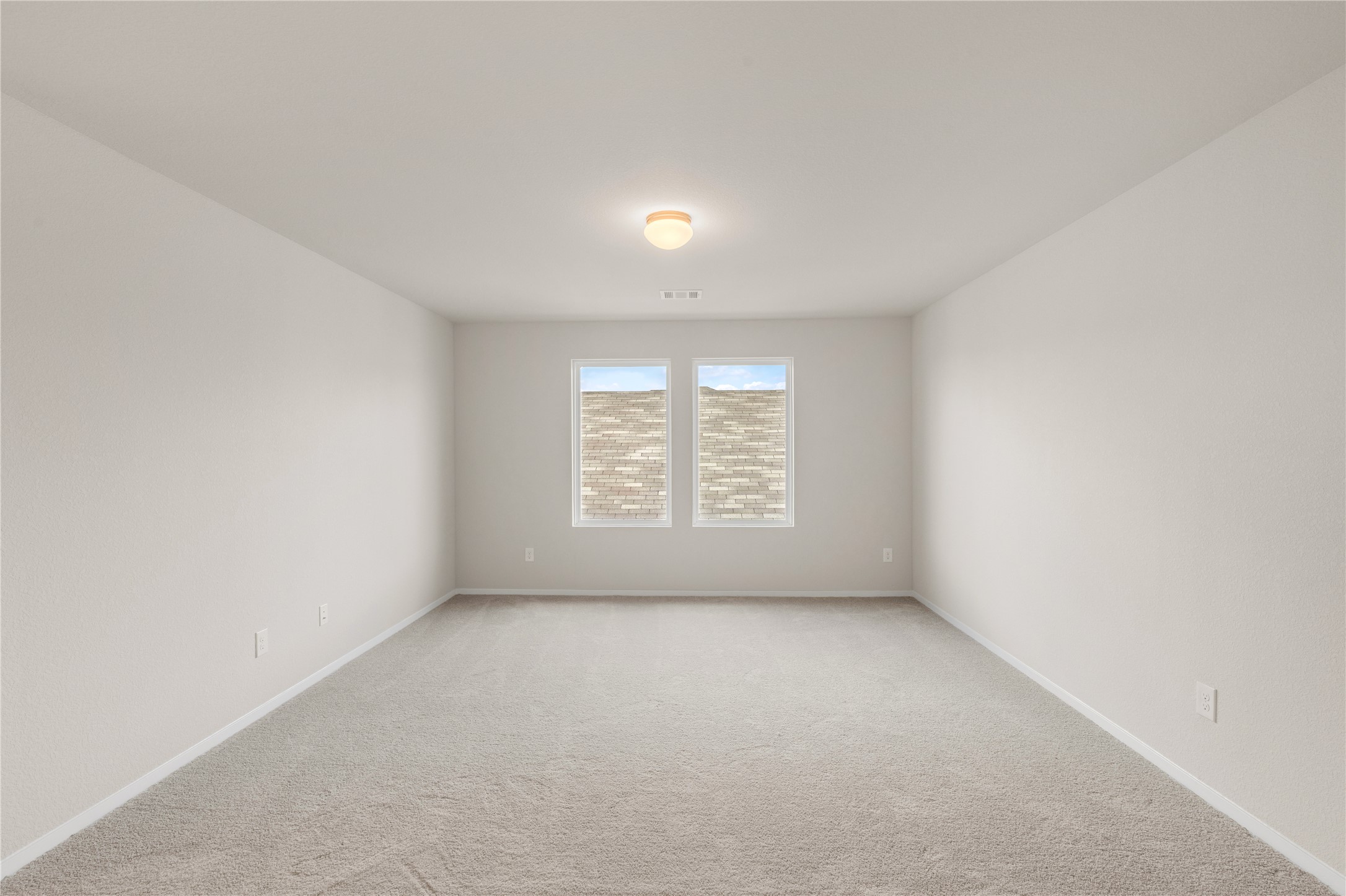 2615 Towy Road Manor, TX 78653 - Photo 22 of 38 Empty room with light colored carpet and baseboards