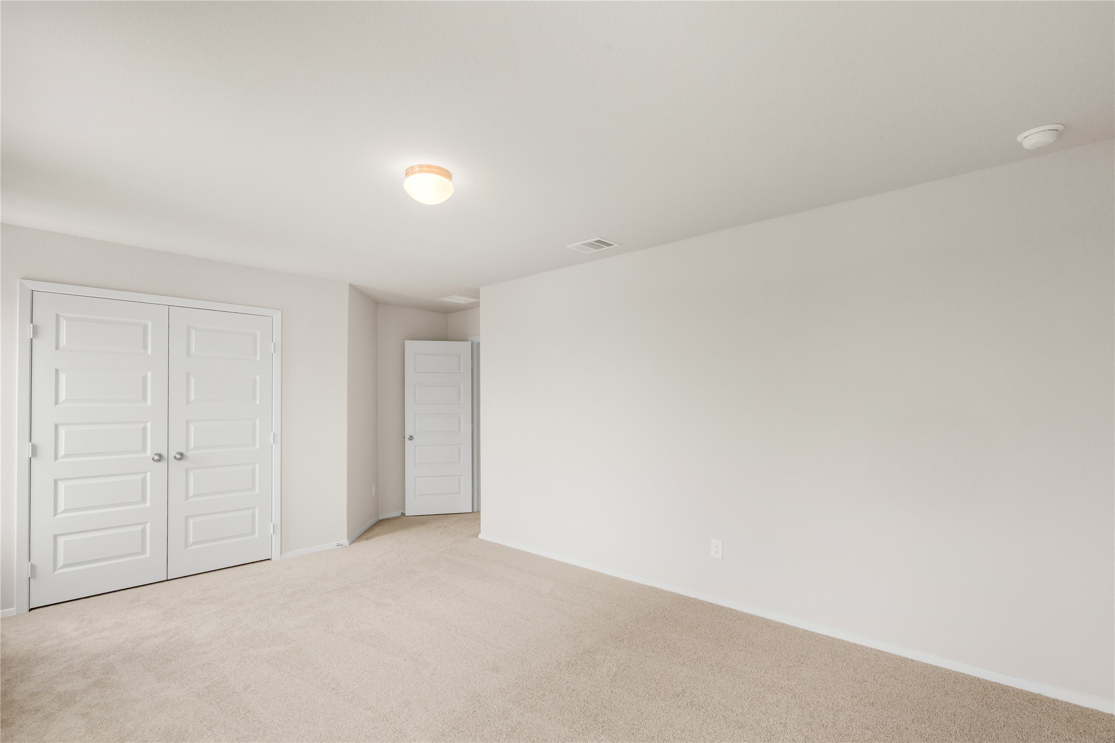 2615 Towy Road Manor, TX 78653 - Photo 24 of 38 Unfurnished bedroom with light colored carpet and a closet