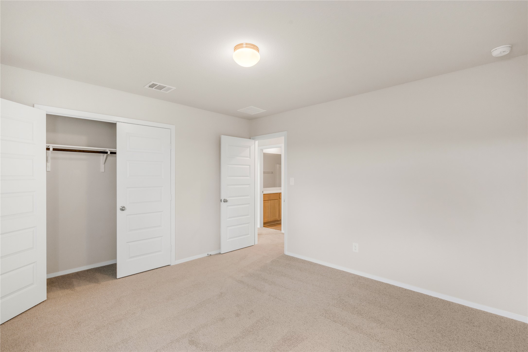 2615 Towy Road Manor, TX 78653 - Photo 27 of 38 Unfurnished bedroom featuring light colored carpet and a closet