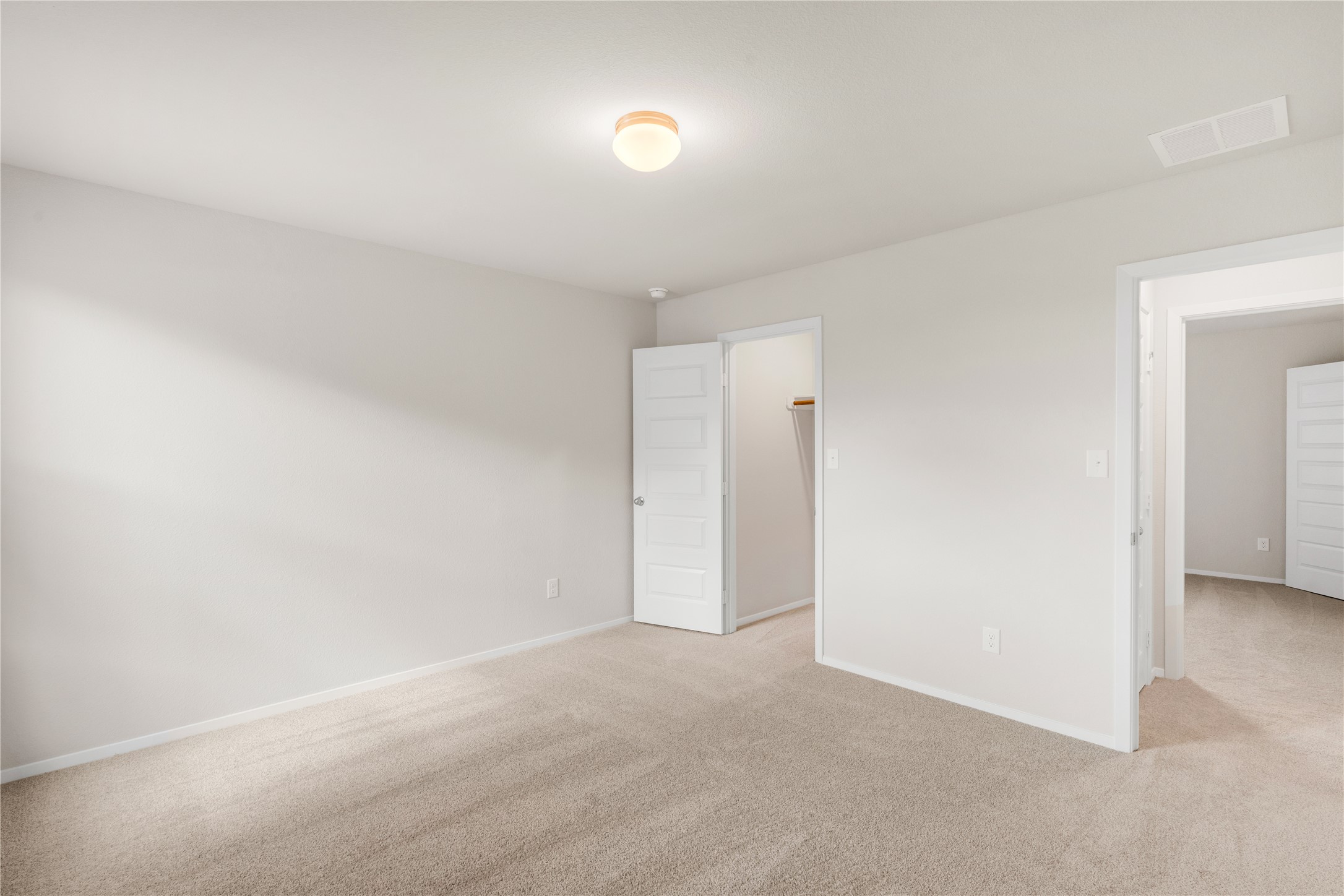 2615 Towy Road Manor, TX 78653 - Photo 29 of 38 Unfurnished bedroom featuring light carpet and baseboards