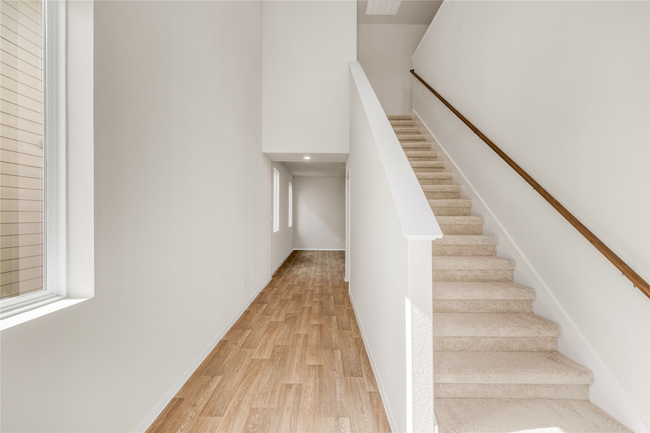 2615 Towy Road Manor, TX 78653 - Photo 5 of 38 Stairway with wood finished floors, a high ceiling, and recessed lighting
