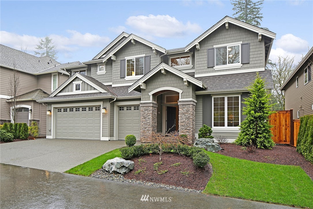 26611 Southeast 9th Way Sammamish, WA 98075 - Photo 1 of 28 a front view of a house with a garden and plants