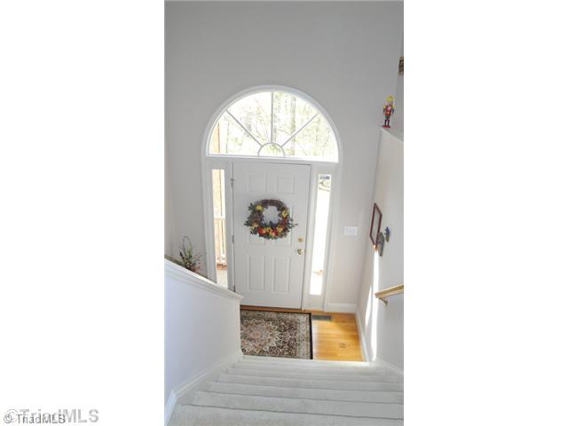 6689 Currieton Drive Oak Ridge, NC 27310 - Photo 1 of 16 Entry. Soaring ceilings and an abundance of Windows like here in the entrance are one of the many unique features of this home