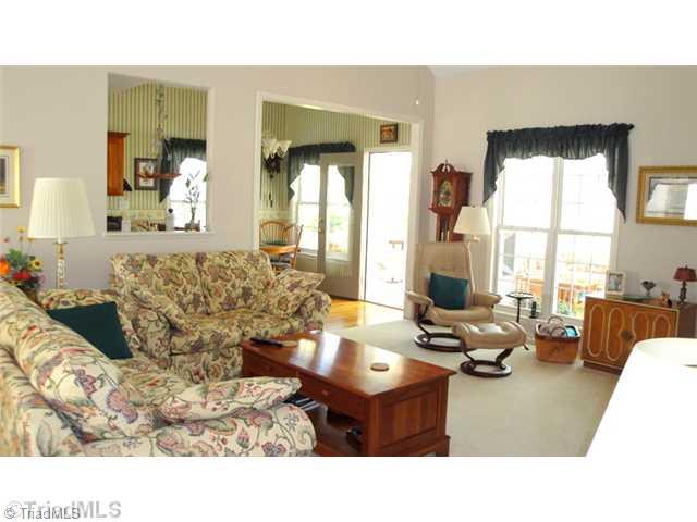 6689 Currieton Drive Oak Ridge, NC 27310 - Photo 2 of 16 Den/Family/Great Room. The main level hosts the great room which is very open to the kitchen, breakfast and Sunroom