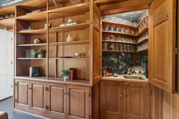 a view of workspace with wooden floor and windows