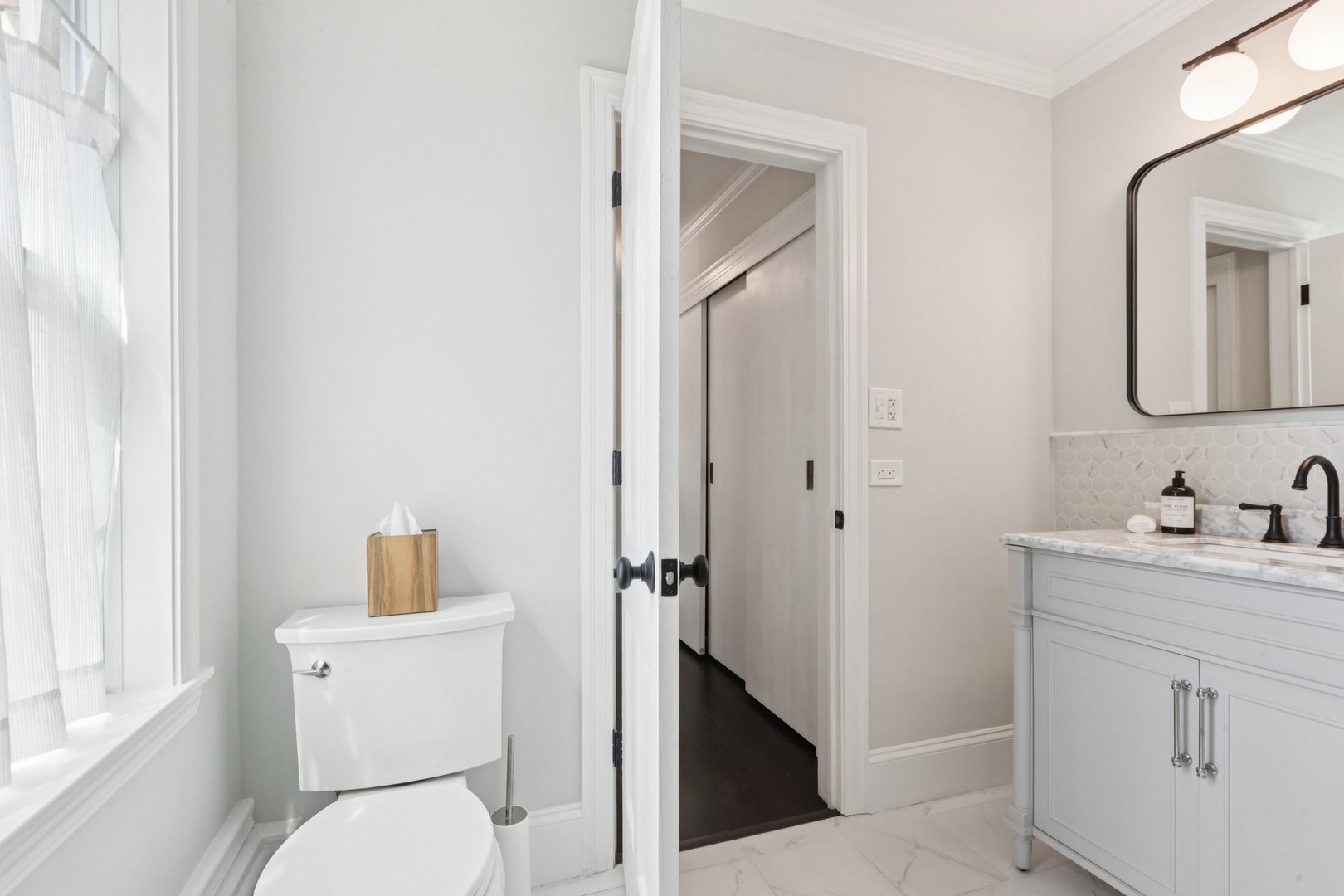 60 Ridge Road Barrington Hills, IL 60010 - Photo 35 of 70 a bathroom with a toilet a sink a vanity and mirror