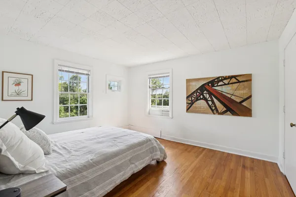a view of a bedroom with a bed and toys