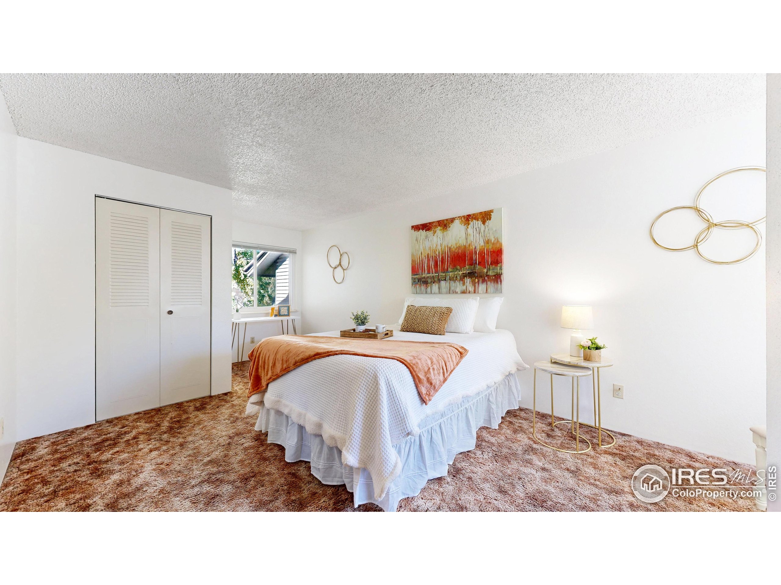 1705 Heatheridge Road, Unit G302 Fort Collins, CO 80526 - Photo 13 of 36 a living room with furniture and painting on the wall