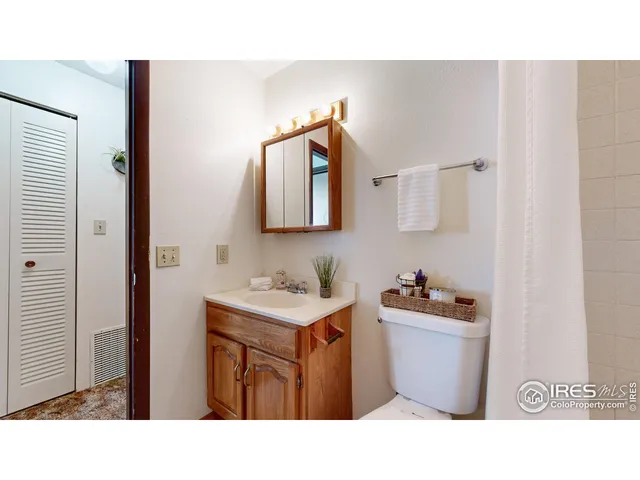 a bathroom with a sink a mirror and a toilet