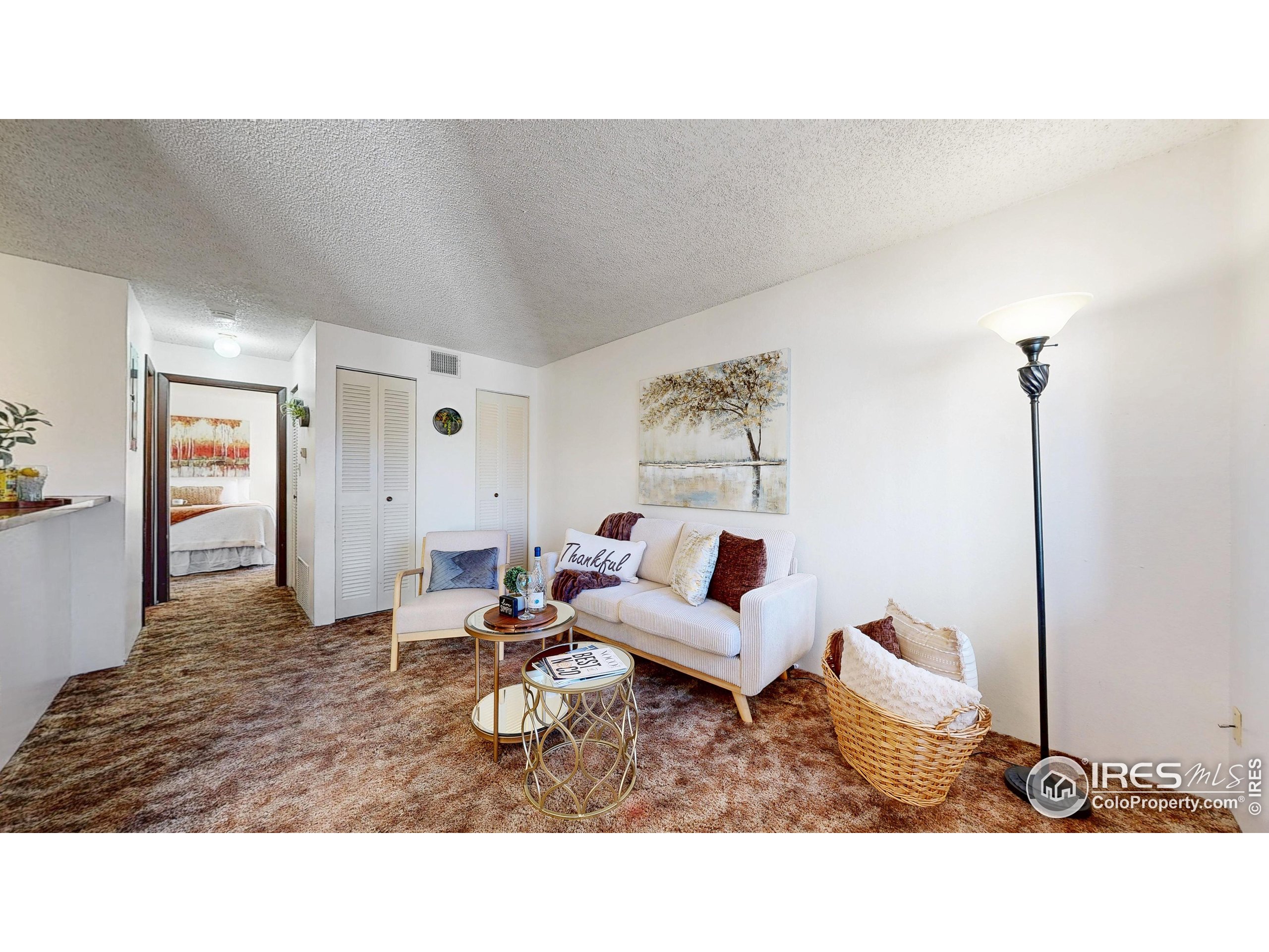 1705 Heatheridge Road, Unit G302 Fort Collins, CO 80526 - Photo 3 of 36 a living room with furniture and wooden floor
