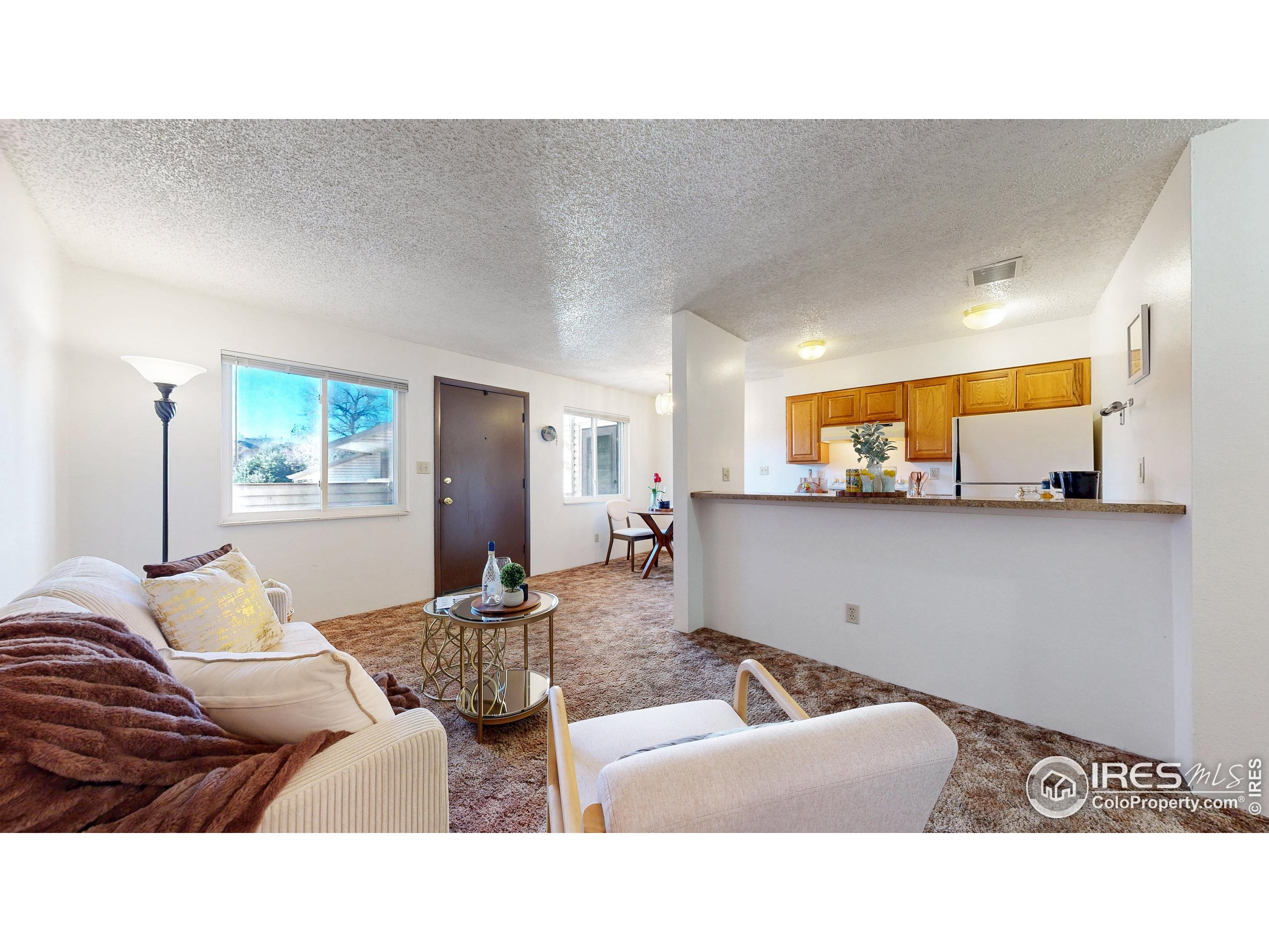 1705 Heatheridge Road, Unit G302 Fort Collins, CO 80526 - Photo 4 of 36 a living room with furniture and a flat screen tv