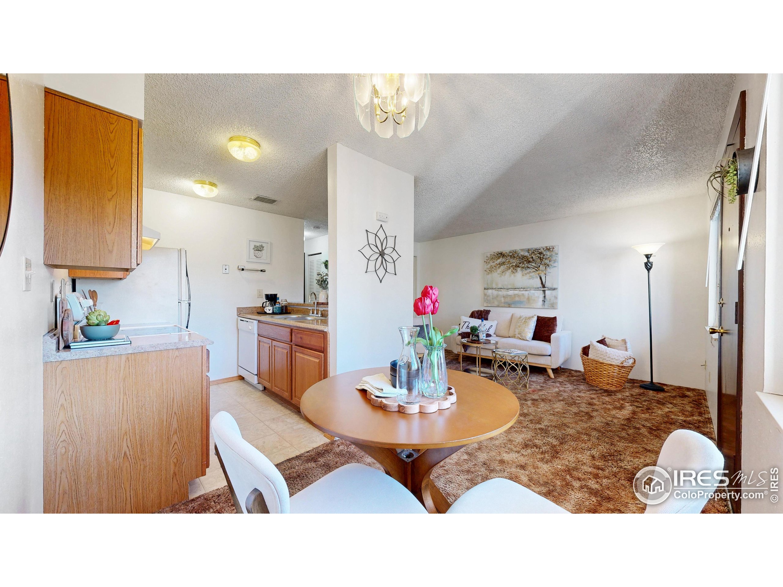 1705 Heatheridge Road, Unit G302 Fort Collins, CO 80526 - Photo 6 of 36 a living room with dining table and chairs