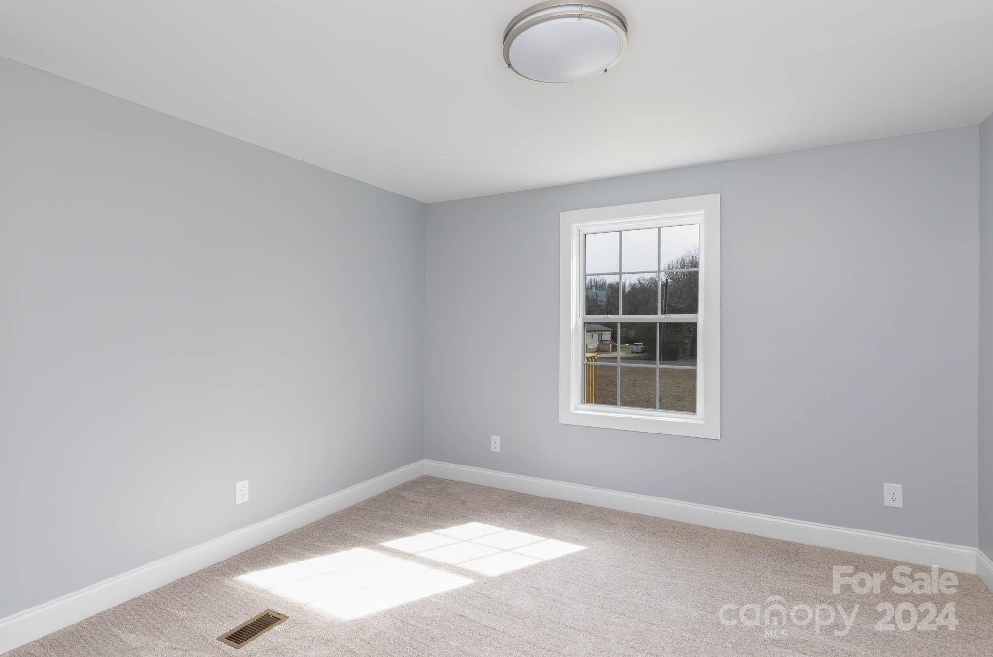 154 Brown Neal Road York, SC 29745 - Photo 17 of 24 an empty room with windows