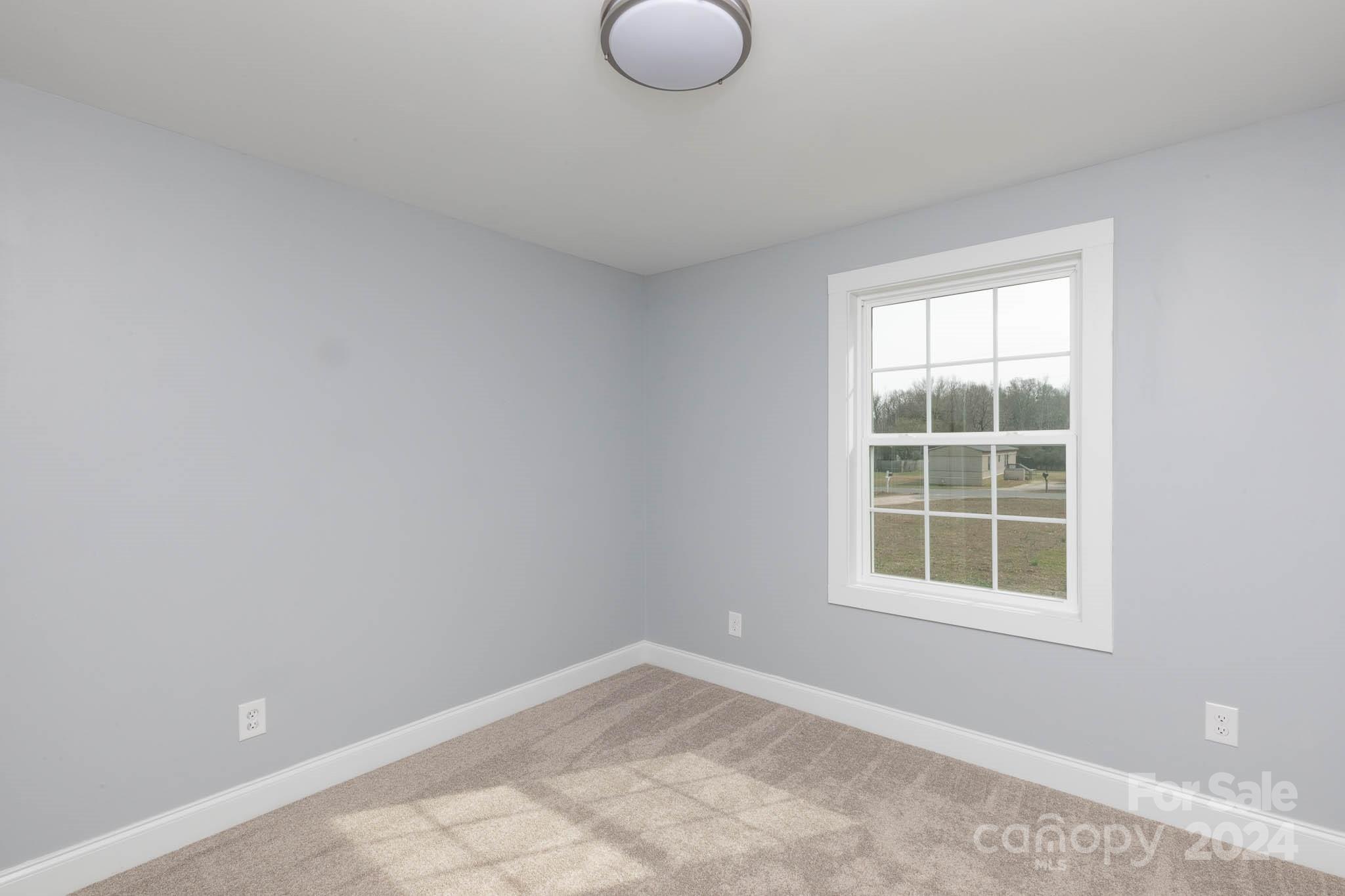 154 Brown Neal Road York, SC 29745 - Photo 19 of 24 an empty room with a window
