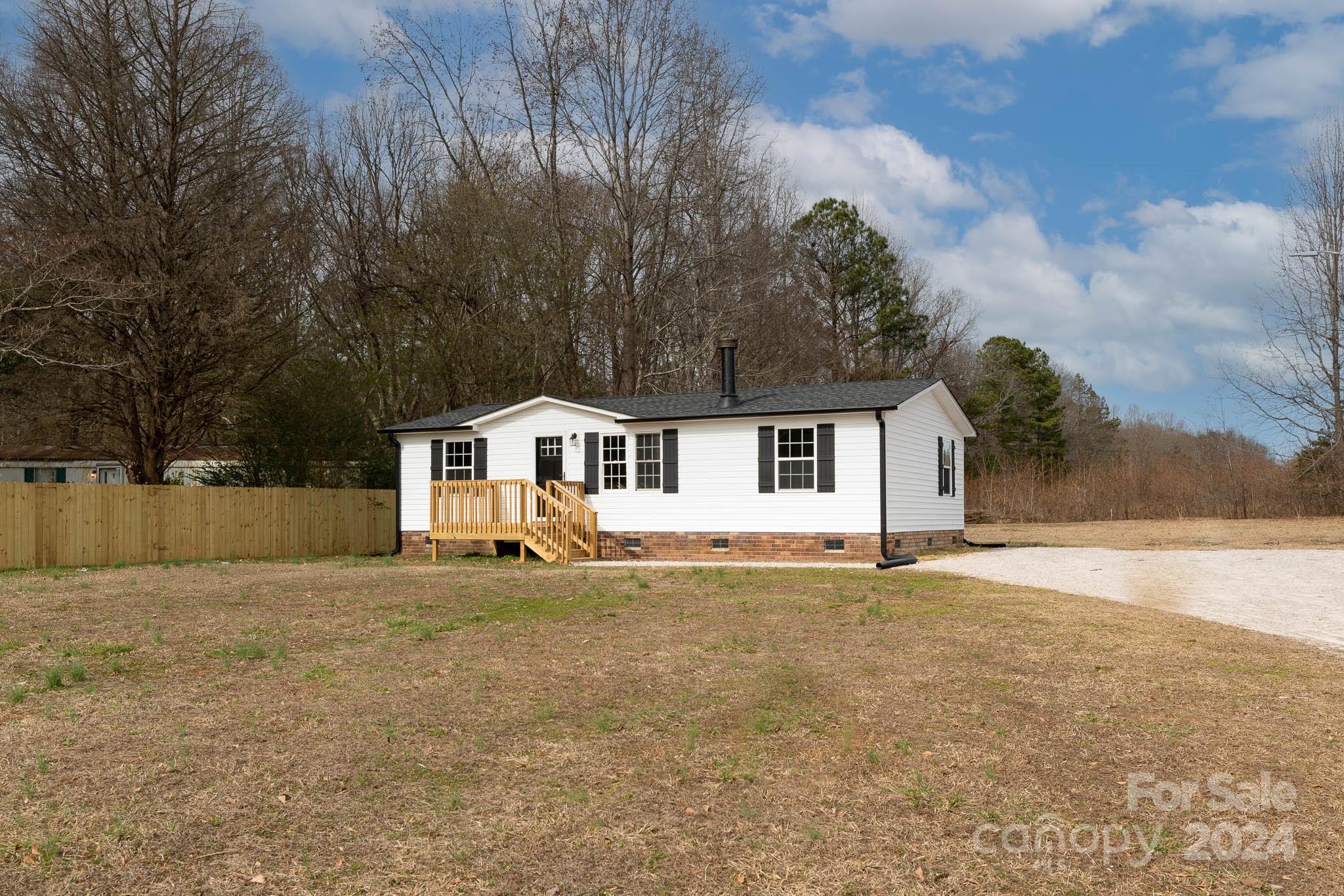 154 Brown Neal Road York, SC 29745 - Photo 2 of 24 a front view of a house with a yard