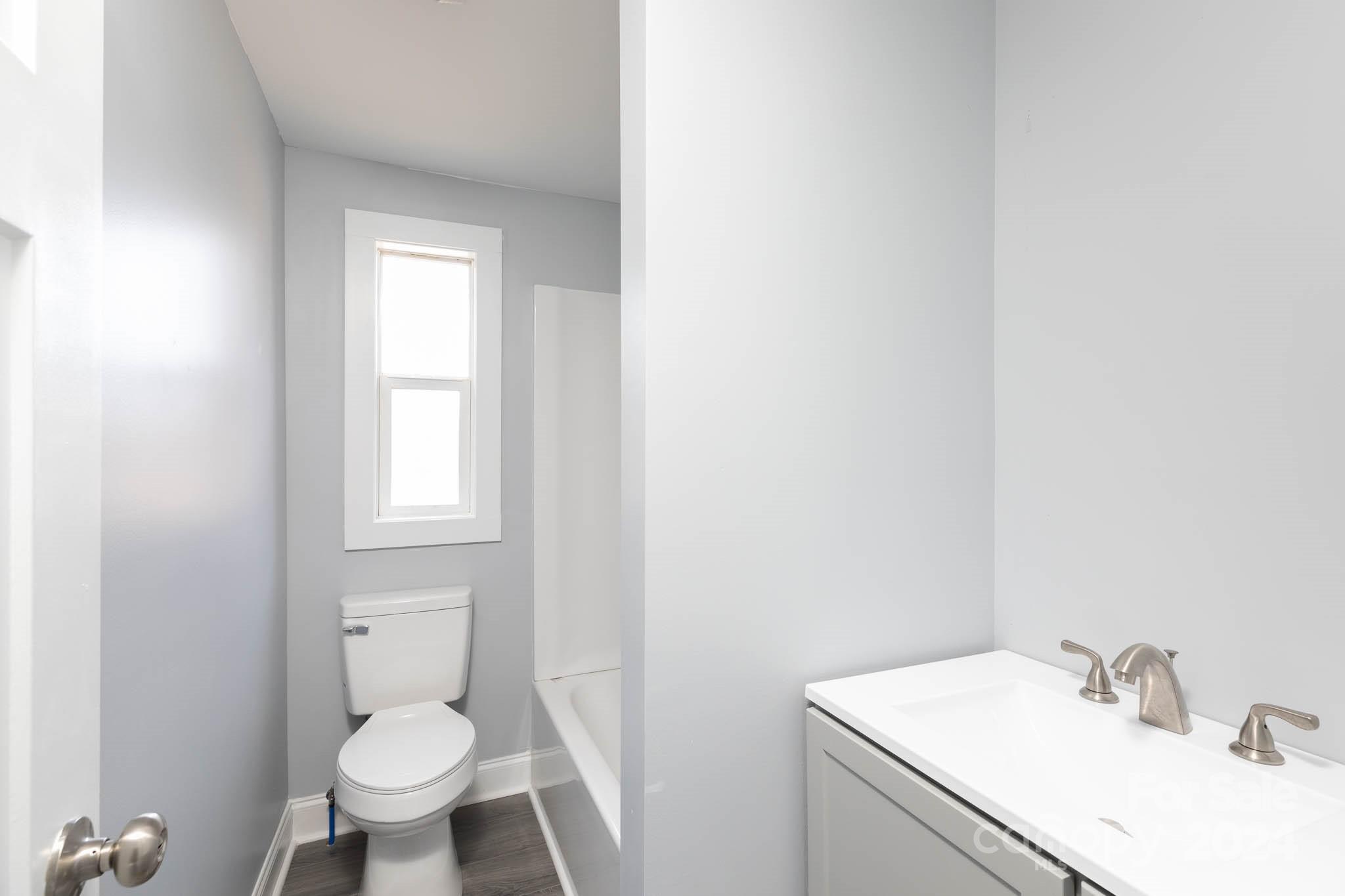 154 Brown Neal Road York, SC 29745 - Photo 22 of 24 a bathroom with a sink toilet and vanity