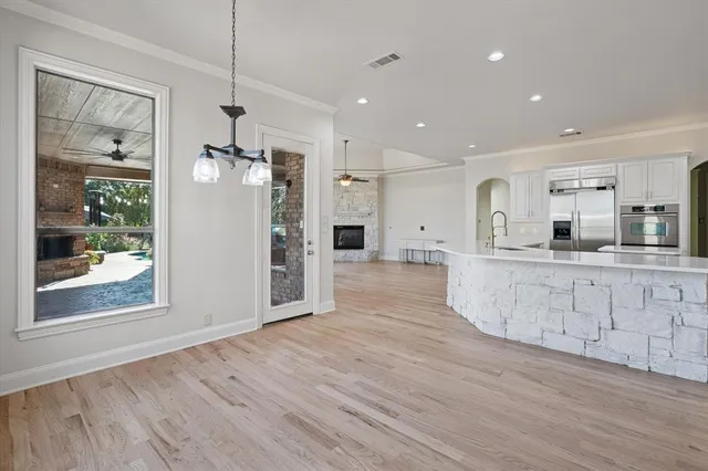 a view of kitchen with cabinets and wooden floor