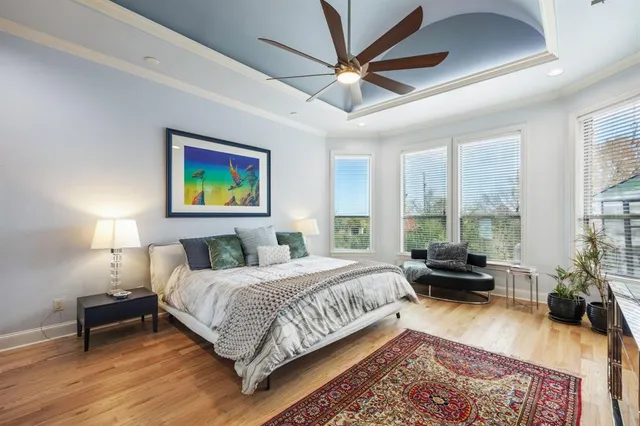 a white bath tub sitting in a bathroom and shower