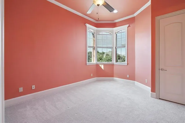 a bed room with a bed and a dresser