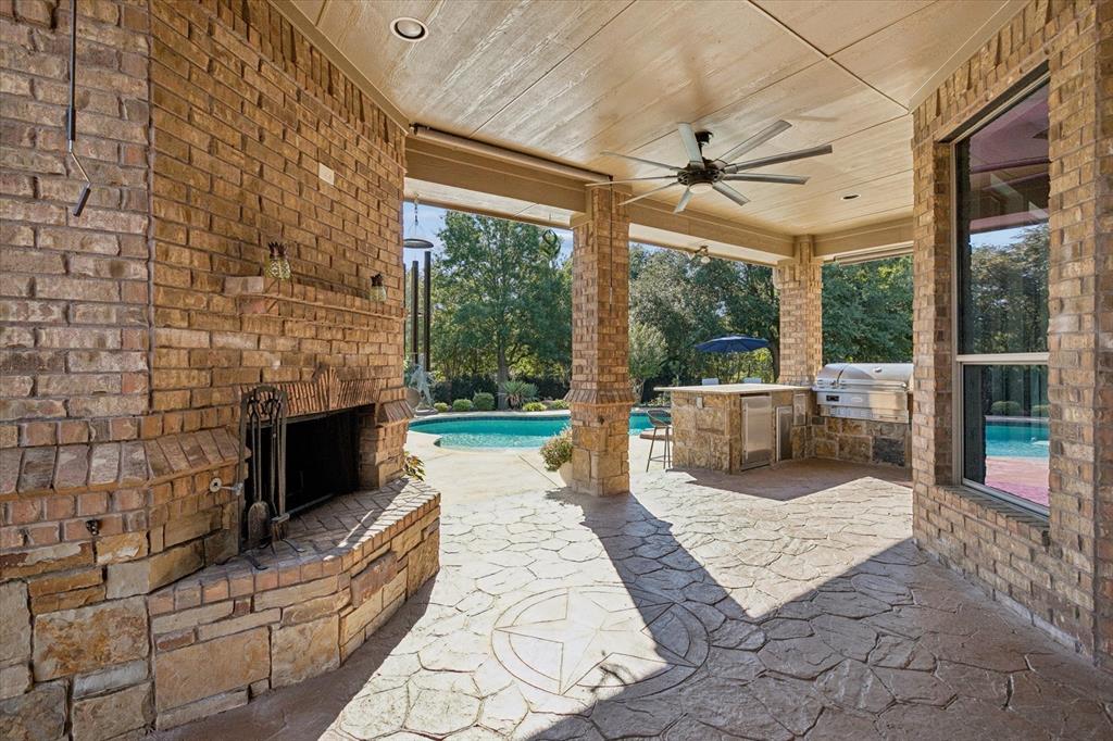 1608 Overlook Terrace Keller, TX 76262 - Photo 31 of 37 Outdoor dining, gas fireplace, kitchen access