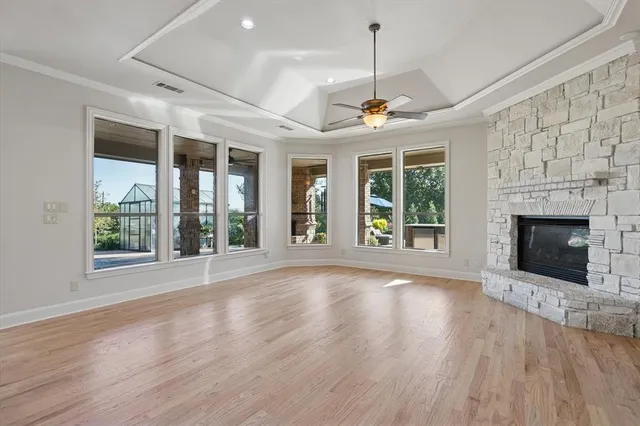wooden floor in an empty room with a fireplace