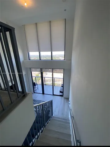 a view of gallery with wooden floor