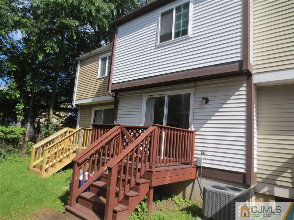 675 Bound Brook Road, Unit 23 Dunellen, NJ 08812 - Photo 2 of 26 a view of a house with a yard and furniture