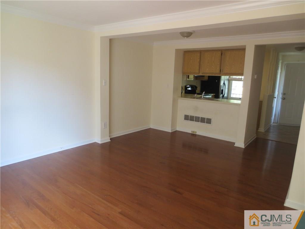 675 Bound Brook Road, Unit 23 Dunellen, NJ 08812 - Photo 11 of 26 a view of a kitchen from the hallway