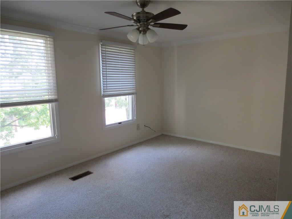 675 Bound Brook Road, Unit 23 Dunellen, NJ 08812 - Photo 16 of 26 an empty room with windows