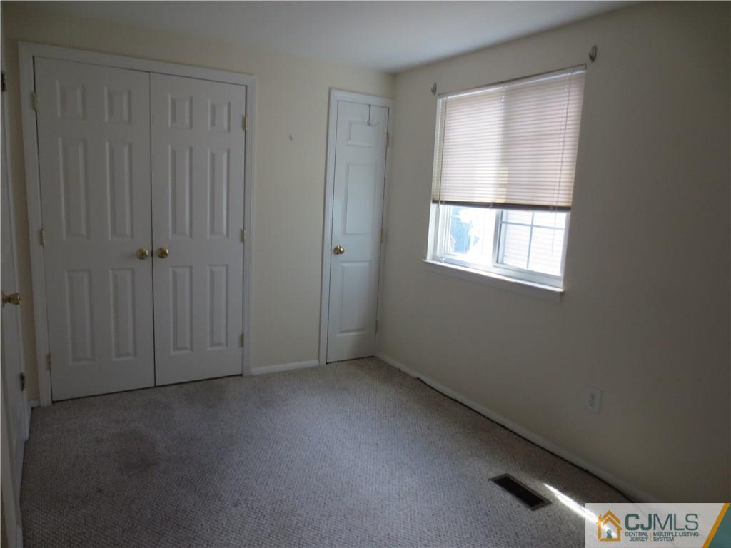 675 Bound Brook Road, Unit 23 Dunellen, NJ 08812 - Photo 17 of 26 an empty room with windows