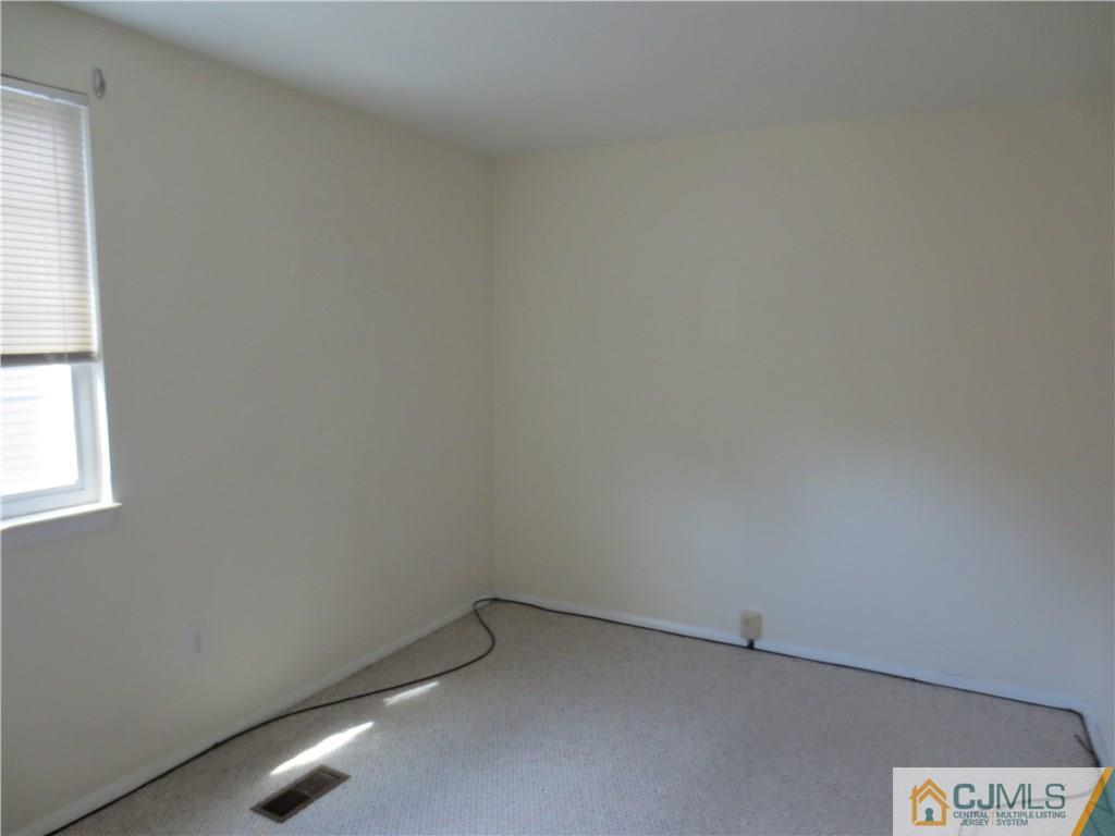 675 Bound Brook Road, Unit 23 Dunellen, NJ 08812 - Photo 18 of 26 an empty room with a window