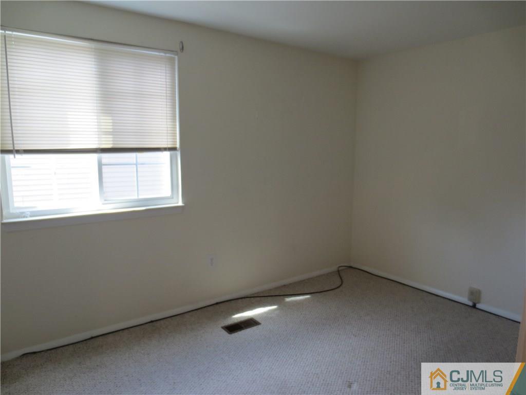 675 Bound Brook Road, Unit 23 Dunellen, NJ 08812 - Photo 19 of 26 an empty room with a window