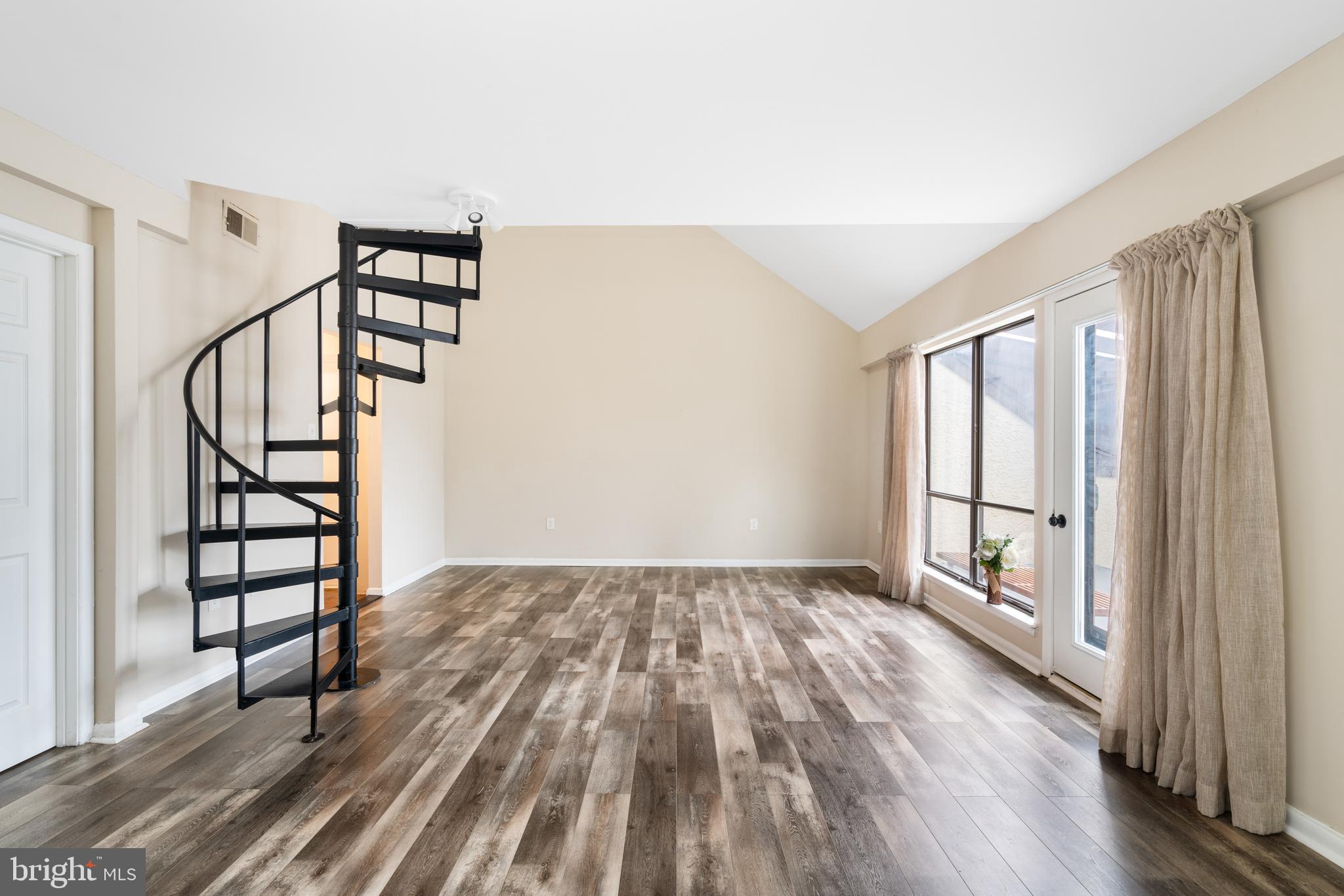 233 Township Line Road, Unit 5F Elkins Park, PA 19027 - Photo 15 of 25 wooden floor in an empty room with a window