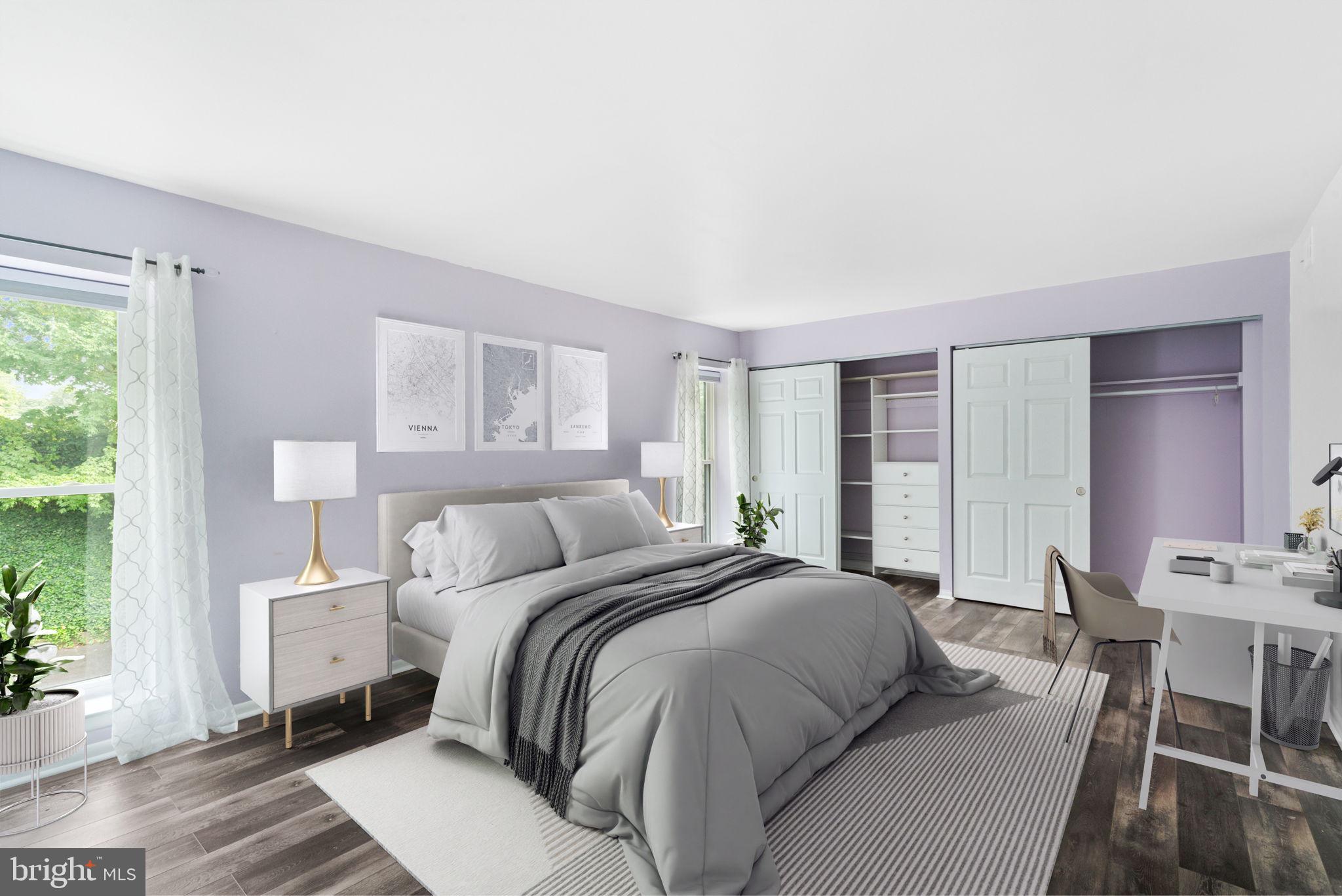 233 Township Line Road, Unit 5F Elkins Park, PA 19027 - Photo 4 of 25 a bedroom with a bed a mirror and a window