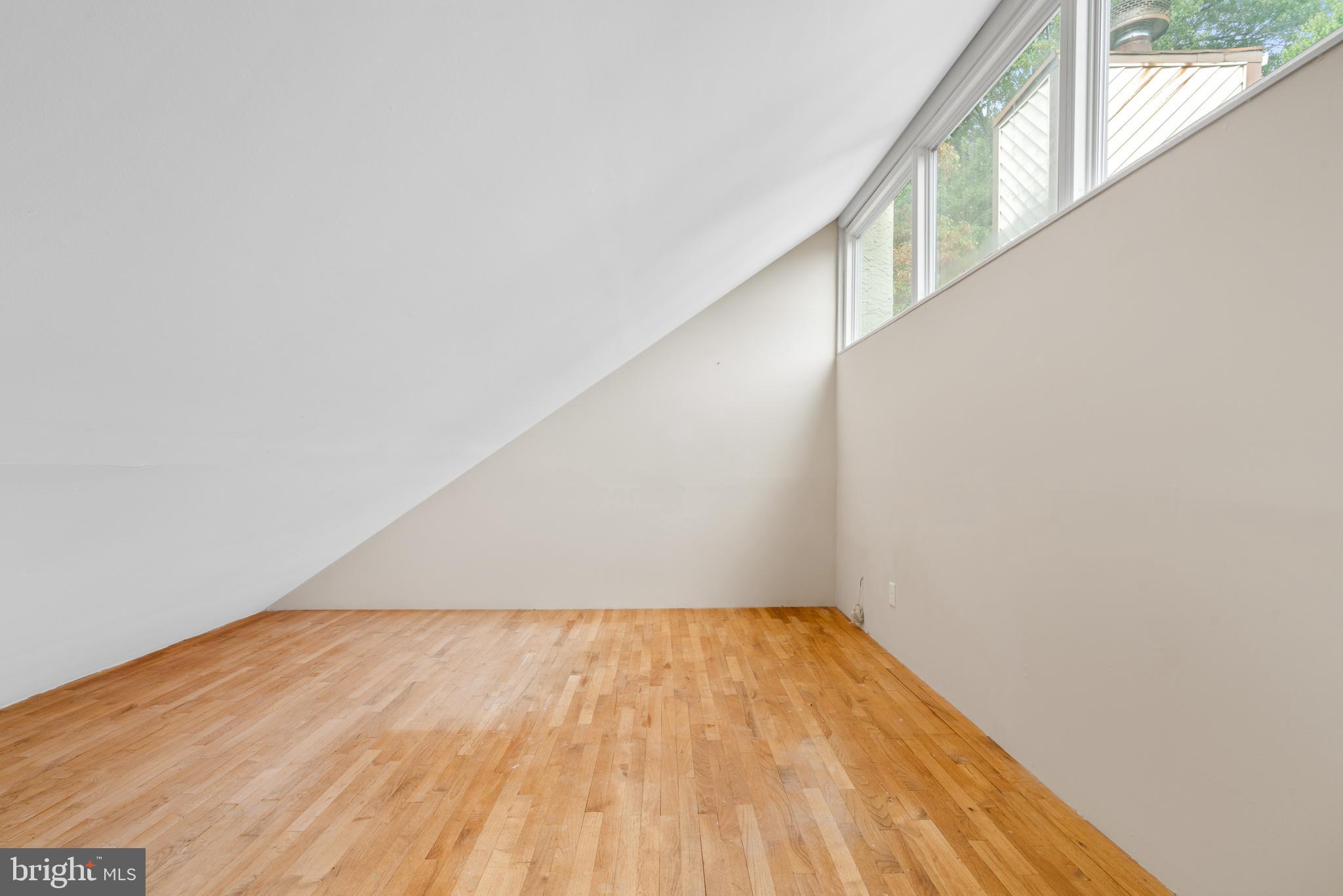 233 Township Line Road, Unit 5F Elkins Park, PA 19027 - Photo 9 of 25 a view of a big room with wooden floor