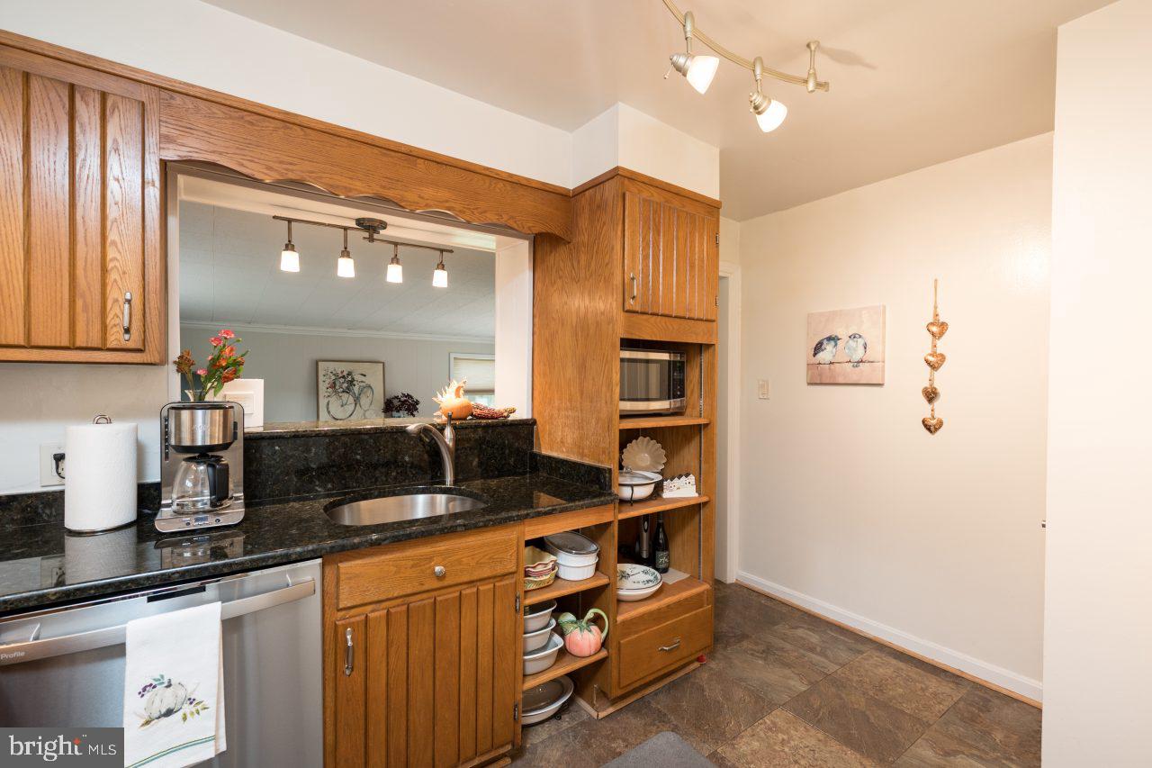8007 Jackson Road Alexandria, VA 22308 - Photo 12 of 49 Granite countertops and custom lighting