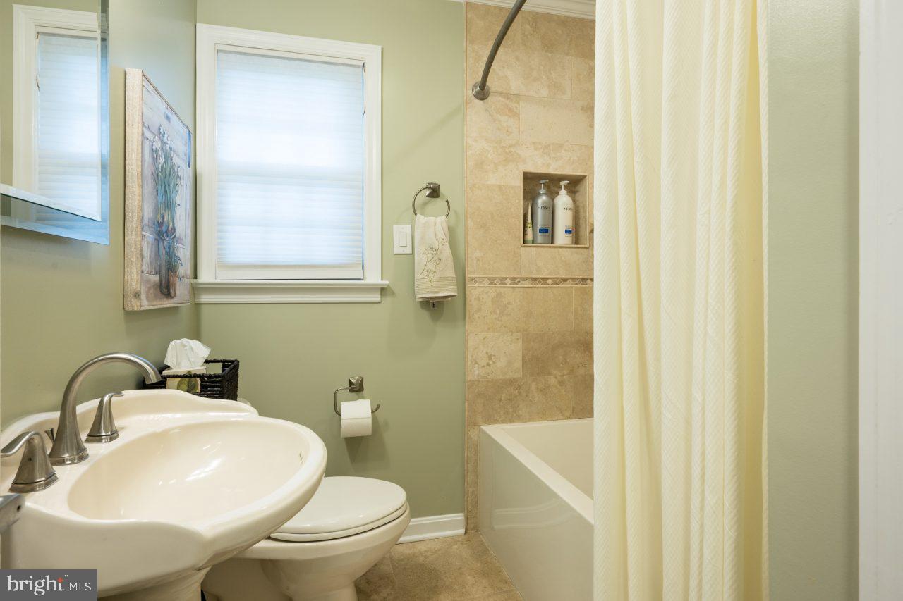 8007 Jackson Road Alexandria, VA 22308 - Photo 20 of 49 Travertine tile in the main bathroom